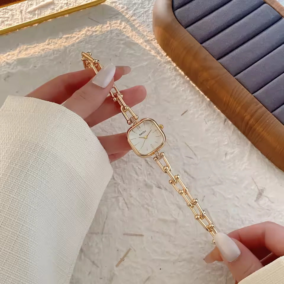 The Elite Eternity Watch redefines elegance with its sophisticated square small dial and a light luxury Cuban-inspired strap. This timepiece seamlessly blends the bold aesthetic of a high-end bracelet with the precision of a modern quartz movement, making it a standout accessory for any trendsetting wardrobe.