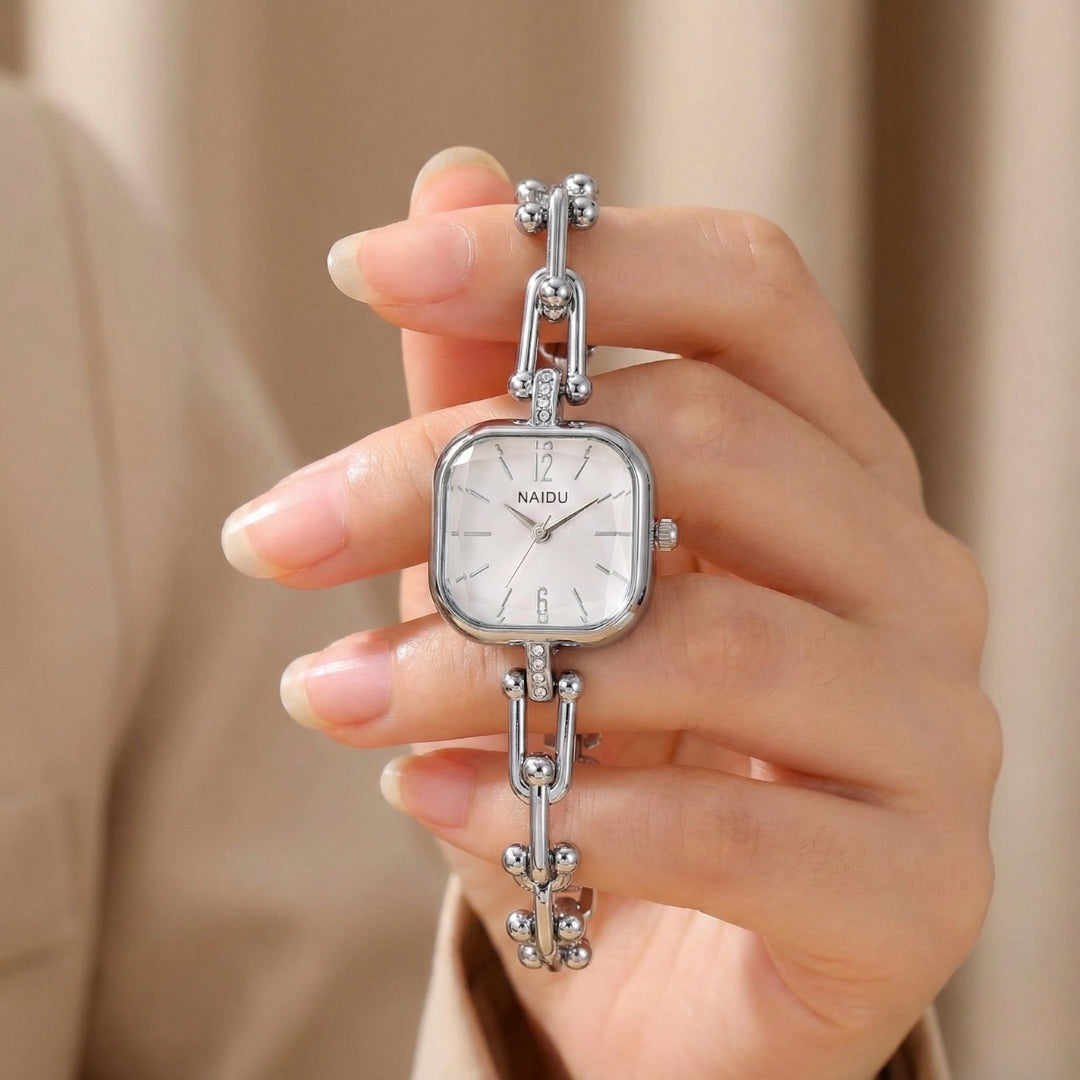 The Elite Eternity Watch redefines elegance with its sophisticated square small dial and a light luxury Cuban-inspired strap. This timepiece seamlessly blends the bold aesthetic of a high-end bracelet with the precision of a modern quartz movement, making it a standout accessory for any trendsetting wardrobe.