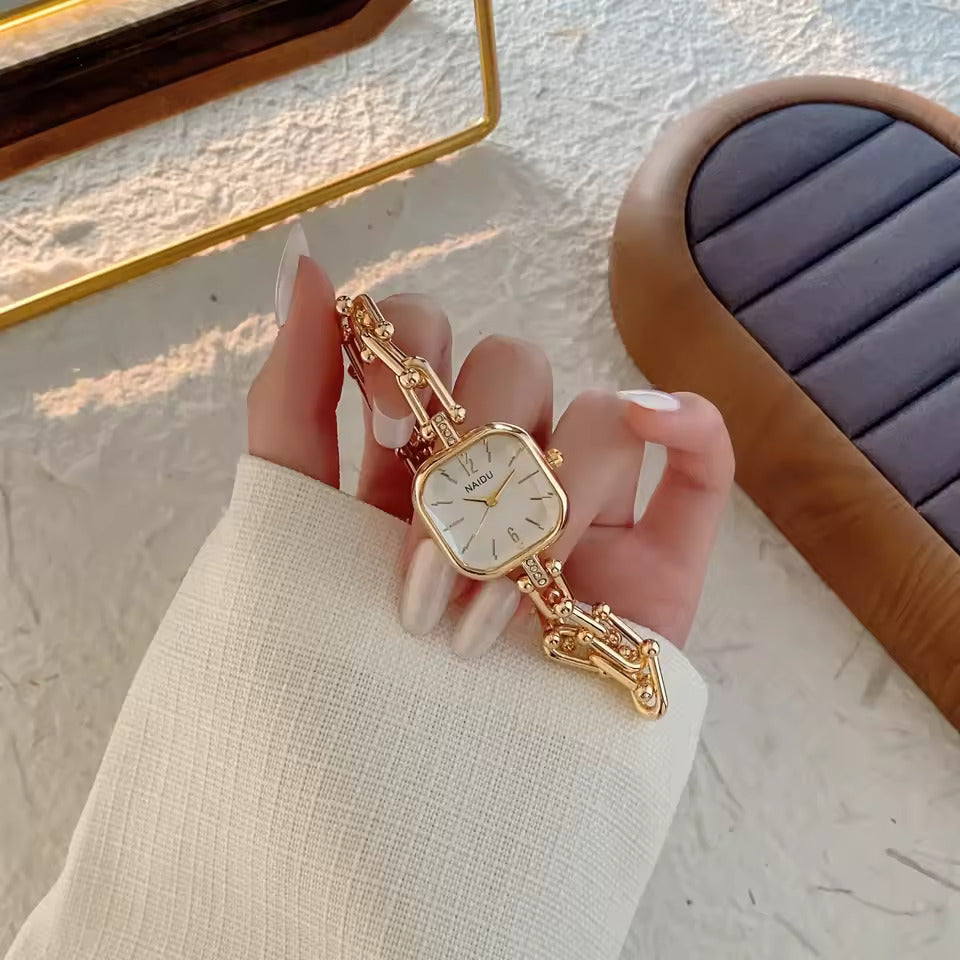 The Elite Eternity Watch redefines elegance with its sophisticated square small dial and a light luxury Cuban-inspired strap. This timepiece seamlessly blends the bold aesthetic of a high-end bracelet with the precision of a modern quartz movement, making it a standout accessory for any trendsetting wardrobe.