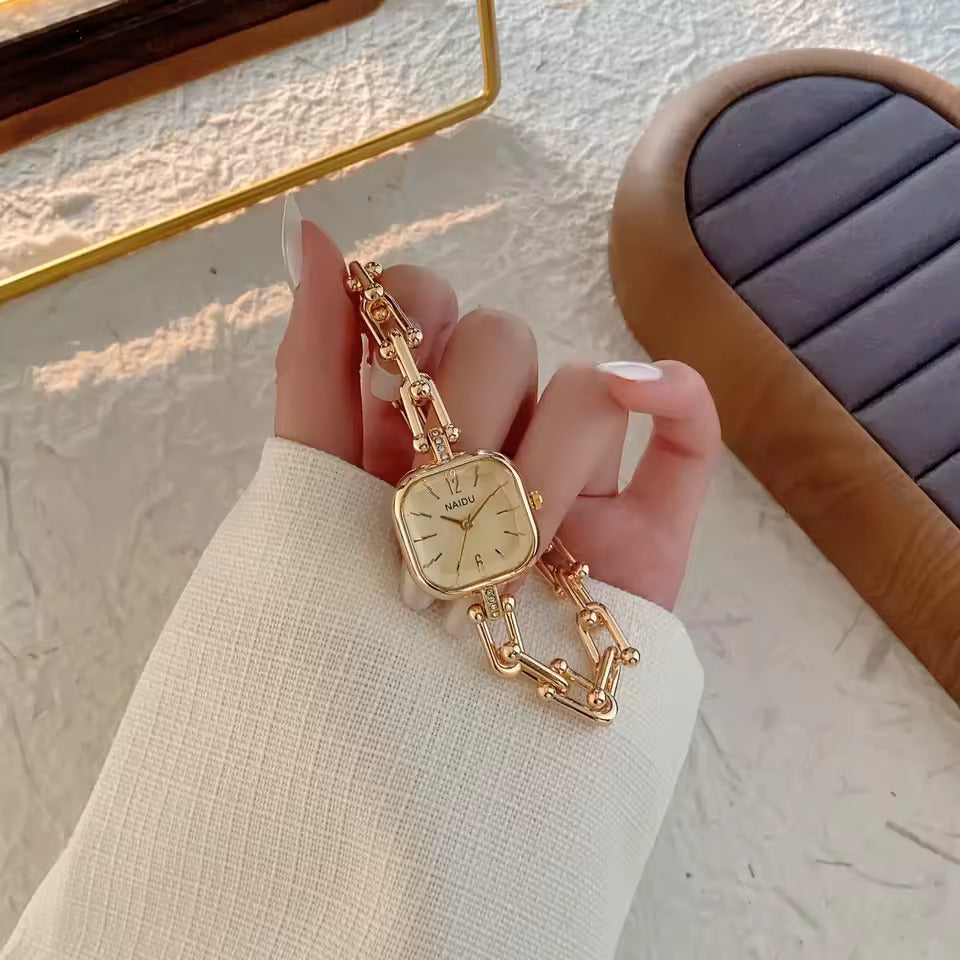 The Elite Eternity Watch redefines elegance with its sophisticated square small dial and a light luxury Cuban-inspired strap. This timepiece seamlessly blends the bold aesthetic of a high-end bracelet with the precision of a modern quartz movement, making it a standout accessory for any trendsetting wardrobe.