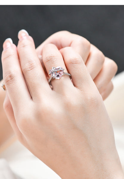 The Tied with Love Ring is a masterpiece of high-design fairy aesthetics, featuring a stunning heart-shaped pink diamond elegantly bound by a shimmering zircon-encrusted knot. 