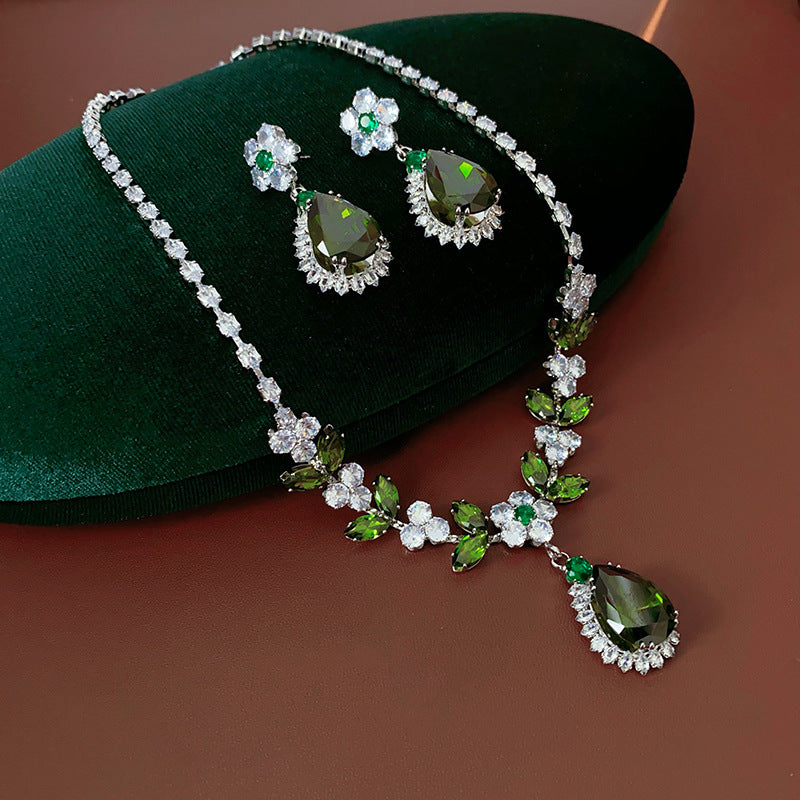 The Verdant Vine Suite offers a high-end necklace and ear rings set, meticulously designed to accentuate the clavicle, bringing a sophisticated sense of design to the modern woman's collection.