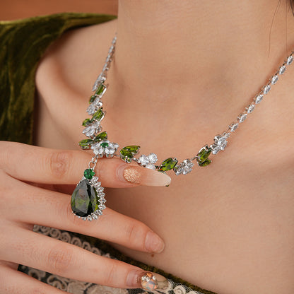 The Verdant Vine Suite offers a high-end necklace and ear rings set, meticulously designed to accentuate the clavicle, bringing a sophisticated sense of design to the modern woman's collection.