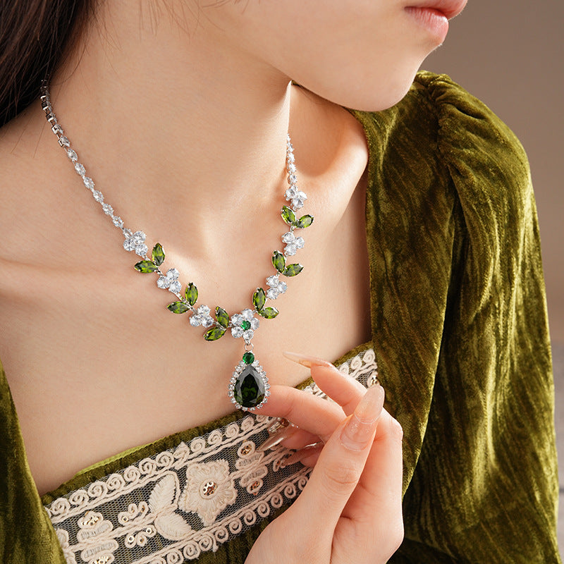 The Verdant Vine Suite offers a high-end necklace and ear rings set, meticulously designed to accentuate the clavicle, bringing a sophisticated sense of design to the modern woman's collection.