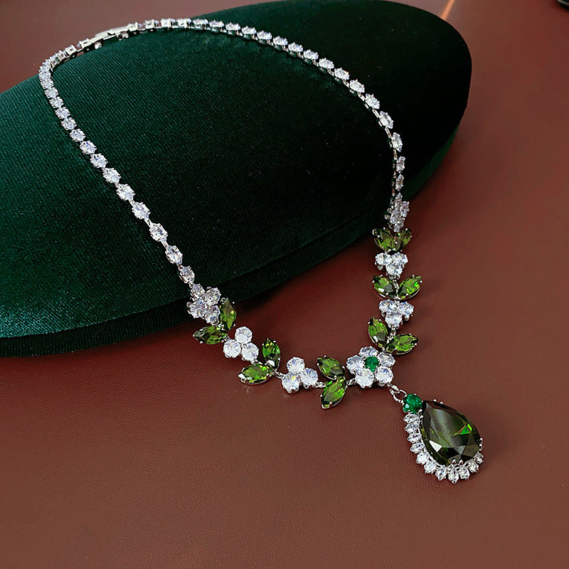 The Verdant Vine Suite offers a high-end necklace and ear rings set, meticulously designed to accentuate the clavicle, bringing a sophisticated sense of design to the modern woman's collection.